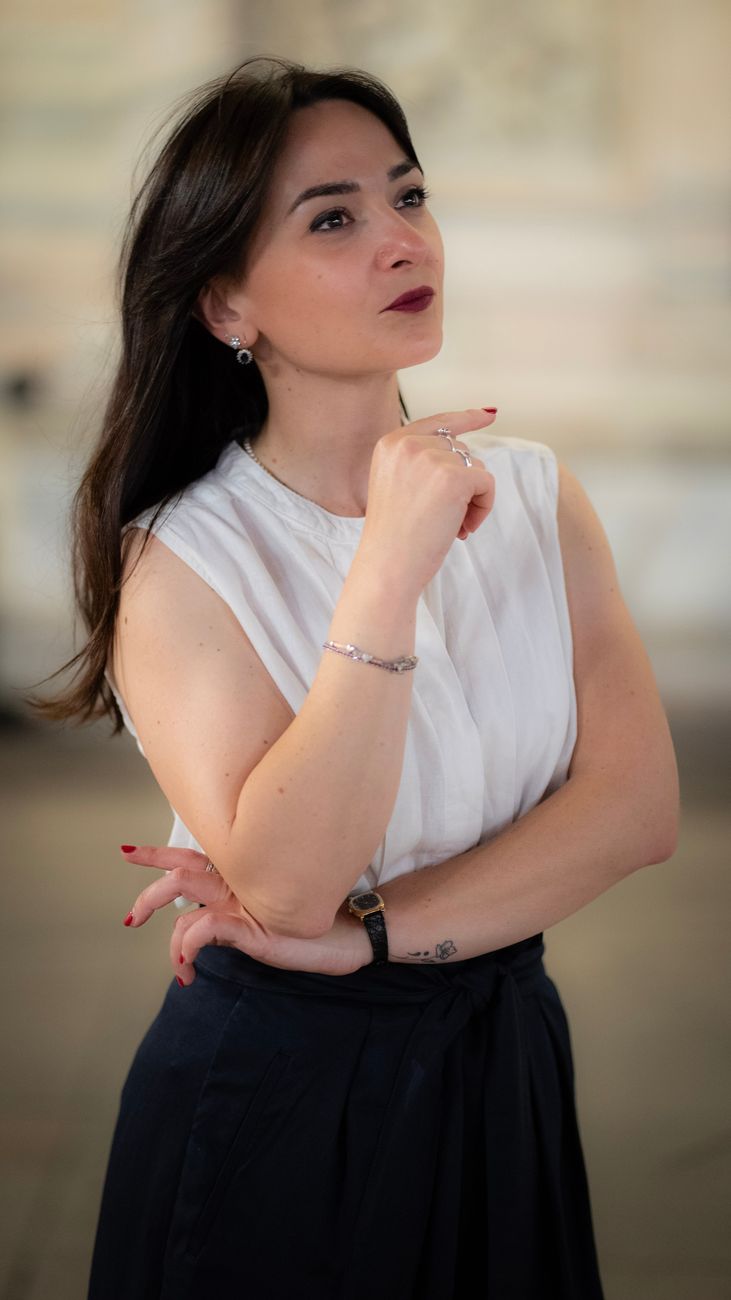elegant young woman posing in milan italy