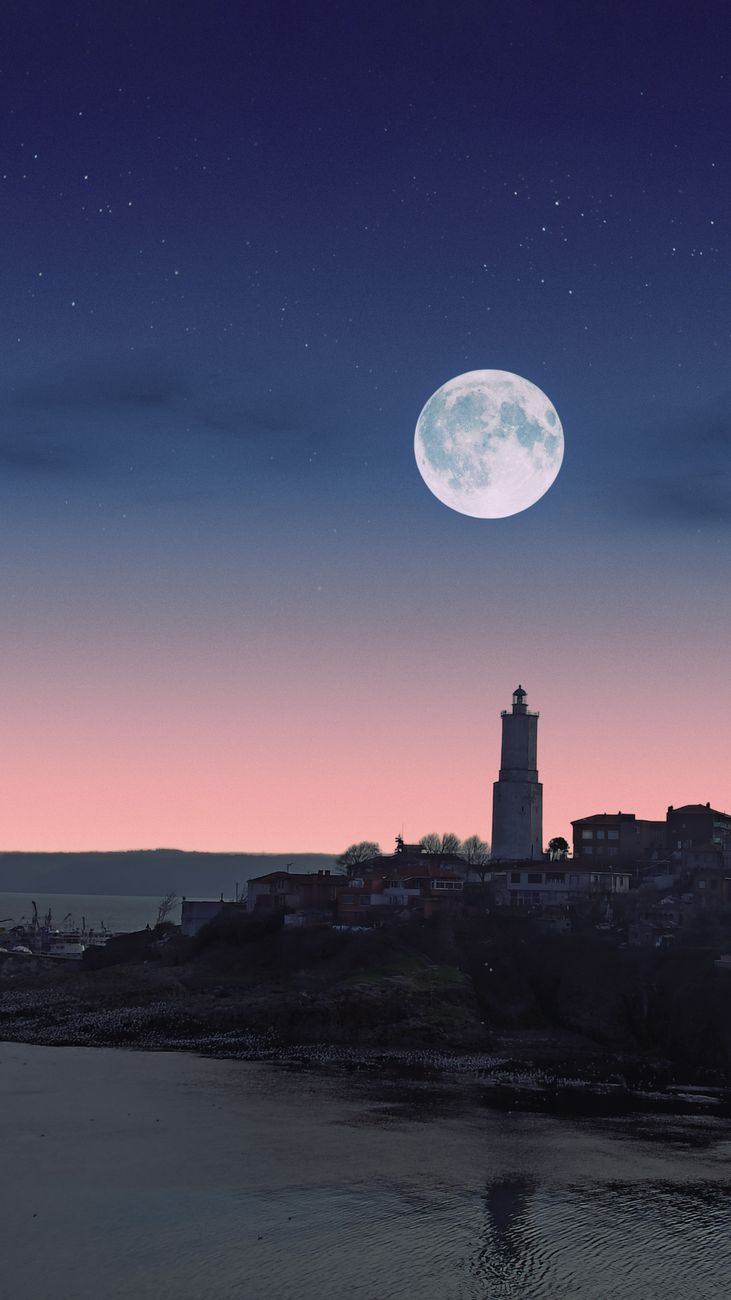 pexels-photo-9742239 full moon over a lighthouse